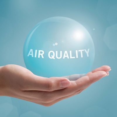 air-quality-text-on-blue-ball-held-in-palm-of-hand