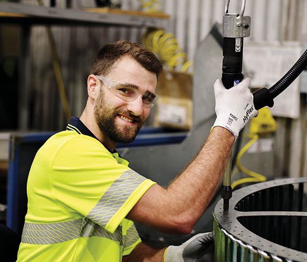 Seeley International Production Operator working with machinery